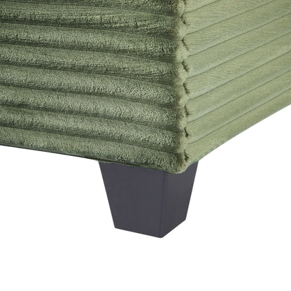 Upholstered olive green velvet U-shaped sectional sofa close-up with black tapered leg on Tampa Home & Garden Store