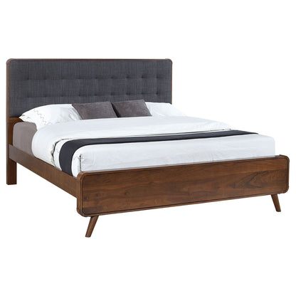 Carson Carrington platform bed with tufted dark gray fabric headboard and wooden frame on Tampa Home & Garden Store