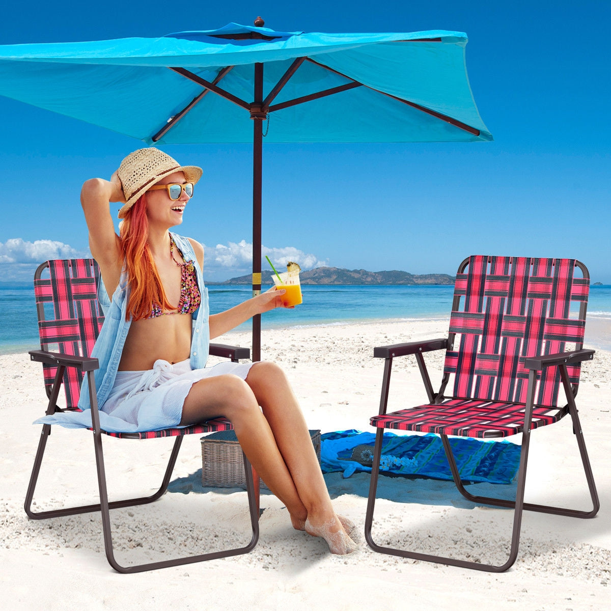 GemGear two folding beach chairs with pink plaid webbing on sandy beach under a blue umbrella on Tampa Home & Garden Store