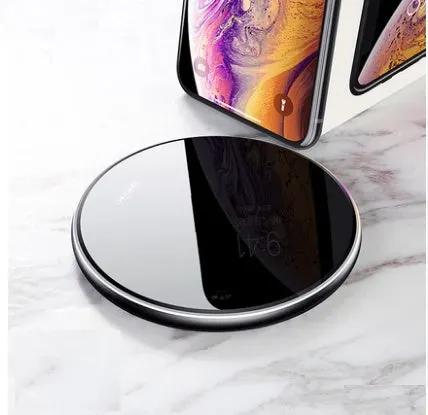 Wireless charger pad, black glossy surface with chrome rim fast charge; two phones nearby on Tampa Home & Garden Store