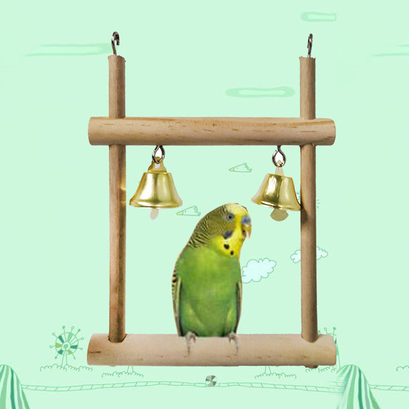 Natural solid wood swing stand with two brass bells and a green parrot perched Sell My Stuff on Tampa Home & Garden Store