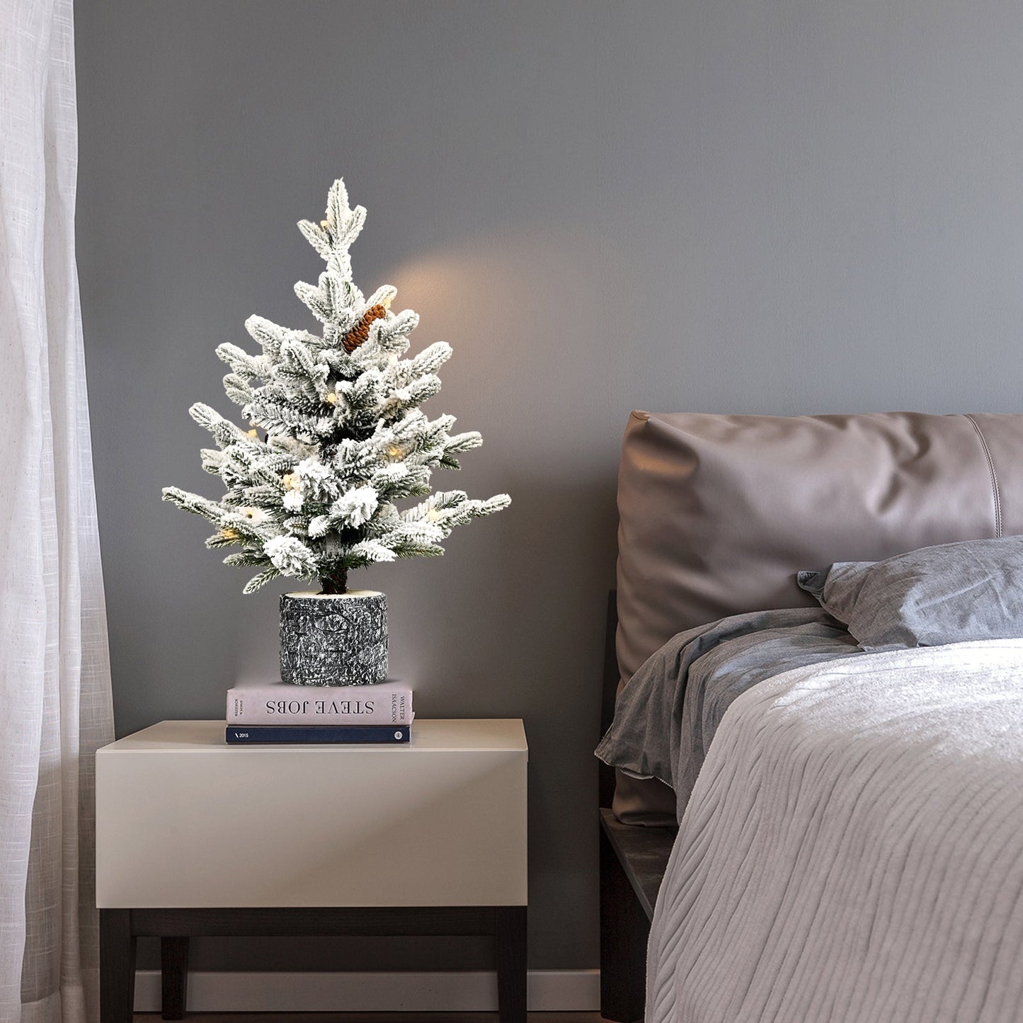 2FT Flocked Christmas Tree with Pot Base on a white nightstand on Tampa Home & Garden Store