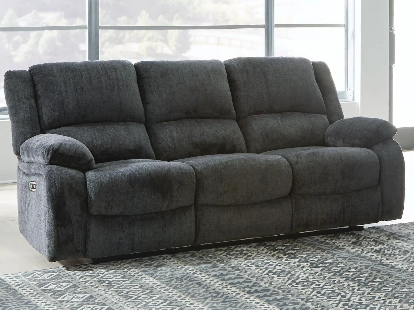 Draycoll reclining sofa by Unique Piece Furniture, dark gray plush upholstery, 3-seat comfort on Tampa Home & Garden Store