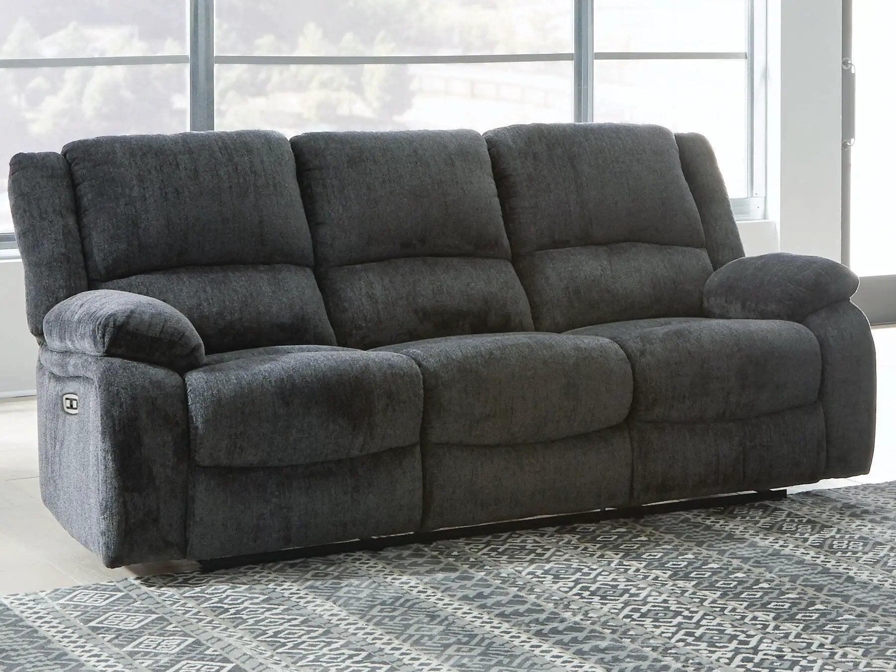 Draycoll reclining sofa by Unique Piece Furniture, dark gray plush upholstery, 3-seat comfort on Tampa Home & Garden Store