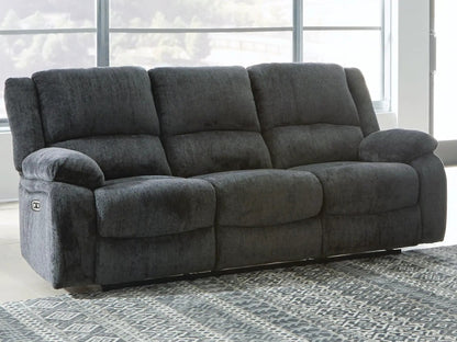 Draycoll reclining sofa by Unique Piece Furniture, dark gray plush upholstery, 3-seat comfort on Tampa Home & Garden Store
