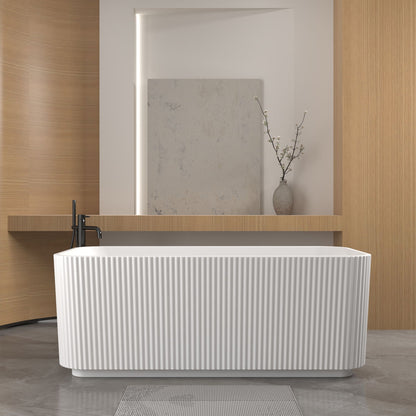 Linear freestanding soaker tub with glossy white ribbed exterior in a modern bathroom on Tampa Home & Garden Store