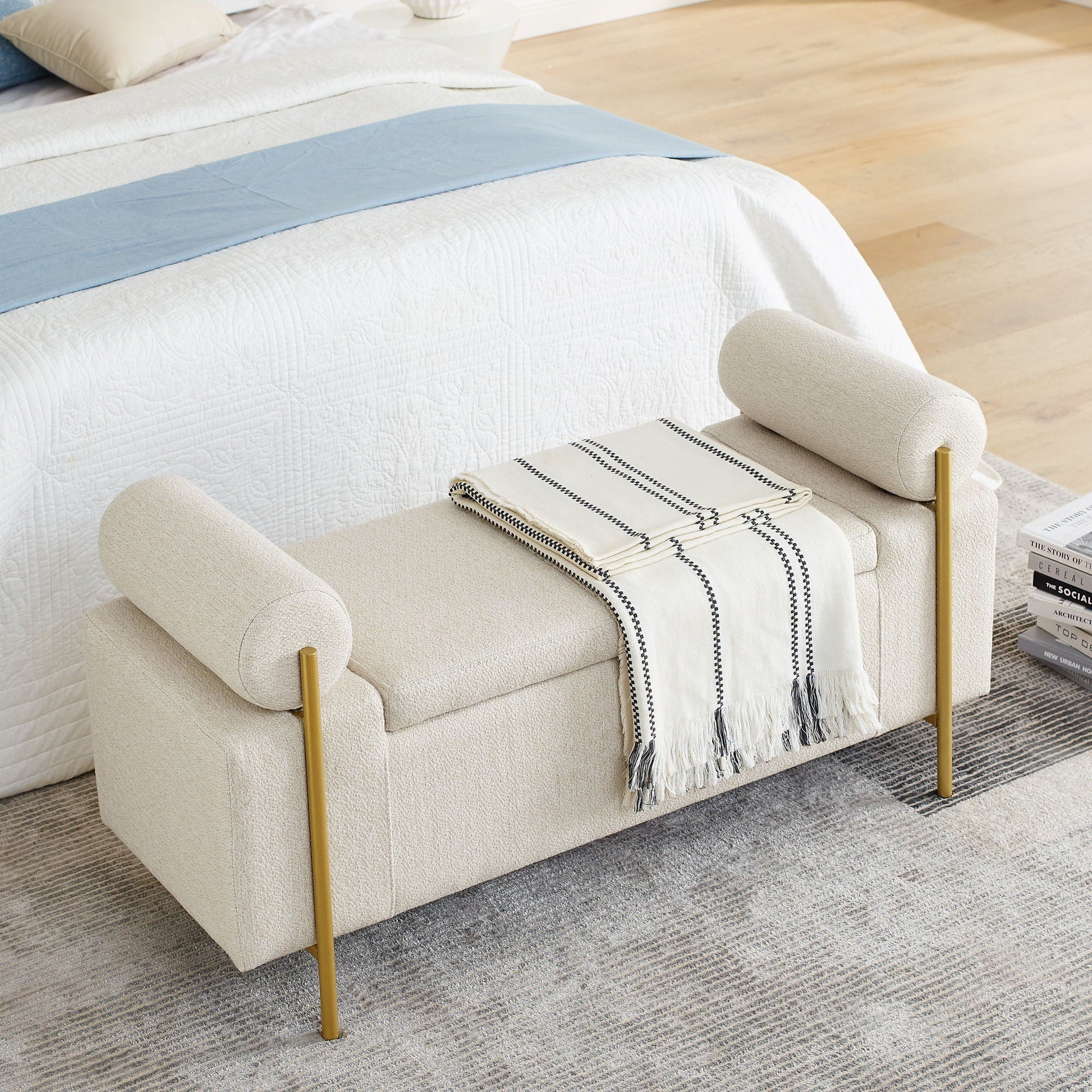 Elegant upholstered storage bench with cylindrical arms and gold iron legs in cream fabric on Tampa Home & Garden Store