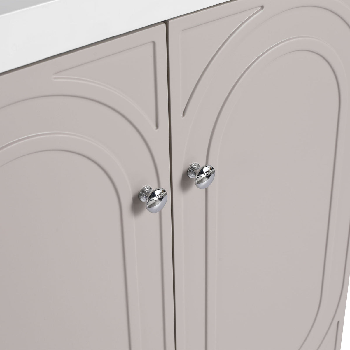 Freestanding bath vanity with taupe cabinet doors and round chrome knobs on Tampa Home & Garden Store