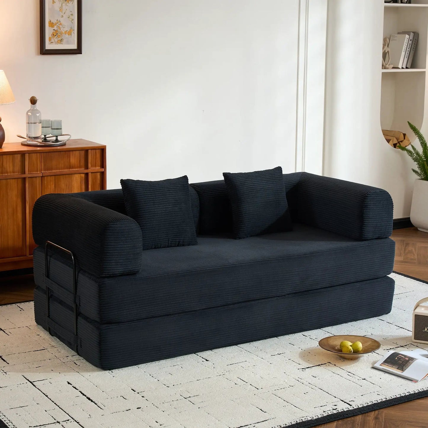 Futon sofa bed in blue ribbed fabric with fixed-frame construction and metal side rails on Tampa Home & Garden Store