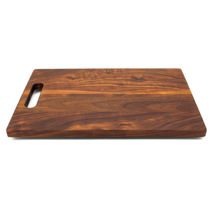 Single Handle Cutting Board in warm brown wood with visible grain and oval cutout handle on Tampa Home & Garden Store