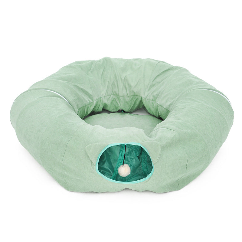 Sell My Stuff mint green cat cave donut bed with teal entrance and hanging pom-pom toy on Tampa Home & Garden Store