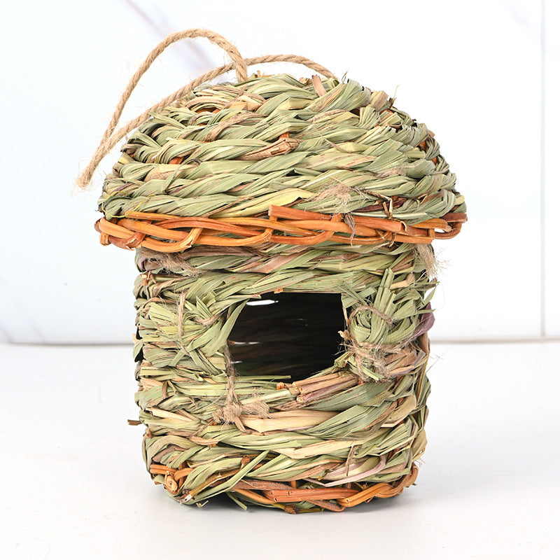 Handwoven straw bird cage nest with rustic green-brown weave and rope handle on Tampa Home & Garden Store