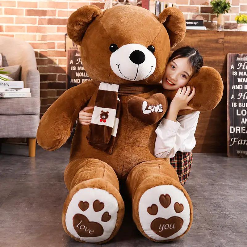 Big Bear Plush Toy with scarf hugged by girl, teddy cuddle toy on Tampa Home & Garden Store on Tampa Home & Garden Store