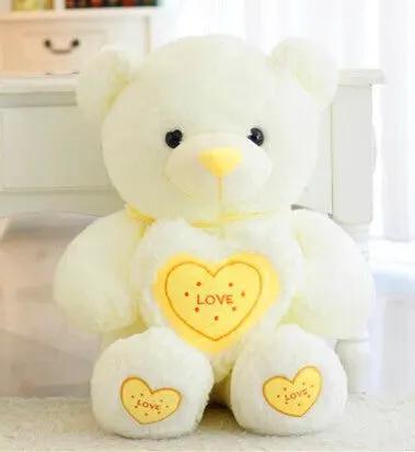White Hugging Love Bear plush with yellow heart chest and paw accents, FLIPSTYLEZLLC on Tampa Home & Garden Store