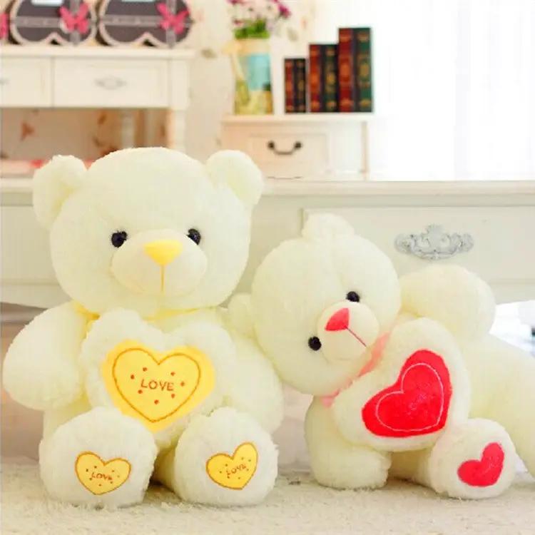 Hugging Bear plush teddy bears, white duo with yellow LOVE heart patches, FLIPSTYLEZLLC on Tampa Home & Garden Store