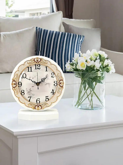 European classic table clock with ornate gold trim on cream ceramic face in a living room on Tampa Home & Garden Store