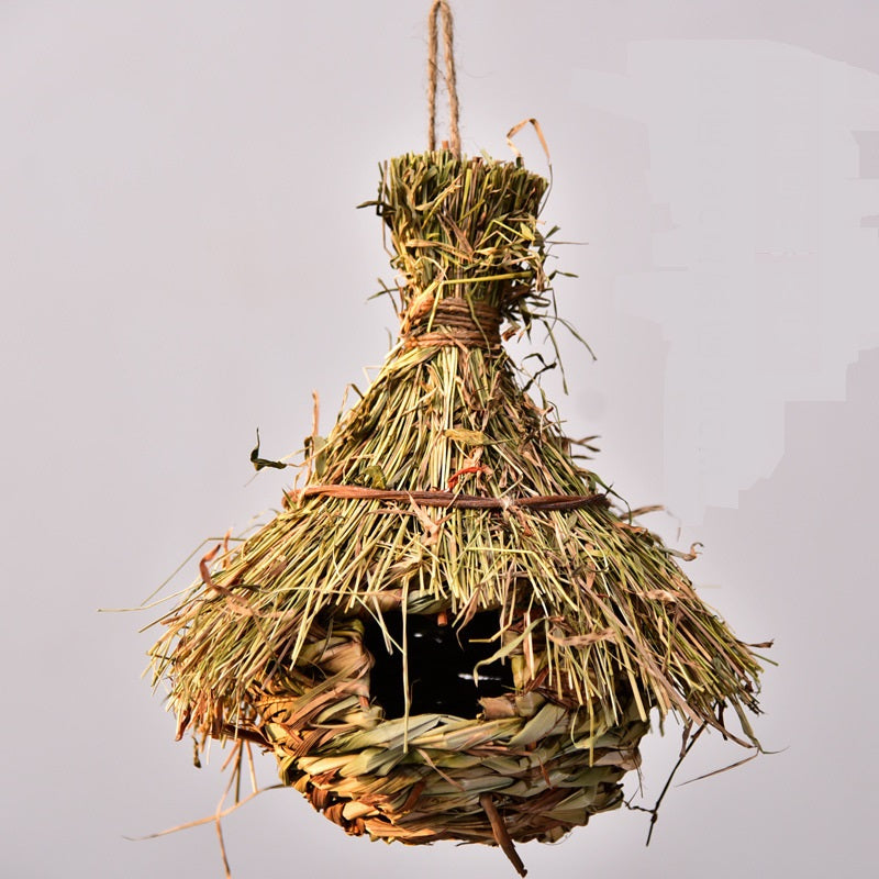 Hand-knitted bird nest garden ornament in natural straw, hanging decorative nest on Tampa Home & Garden Store