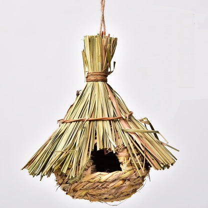 Hand-knitted bird's nest hanging ornament in straw with rope hanger on Tampa Home & Garden Store
