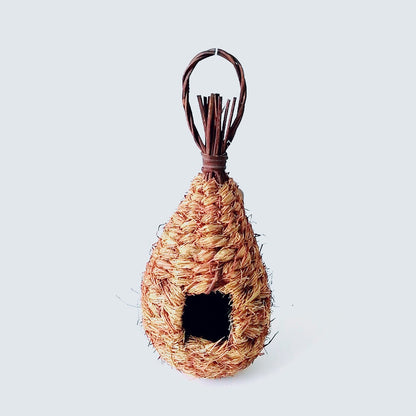 Hand-knitted bird nest decoration hanging ornament with natural tan straw fibers and entrance on Tampa Home & Garden Store