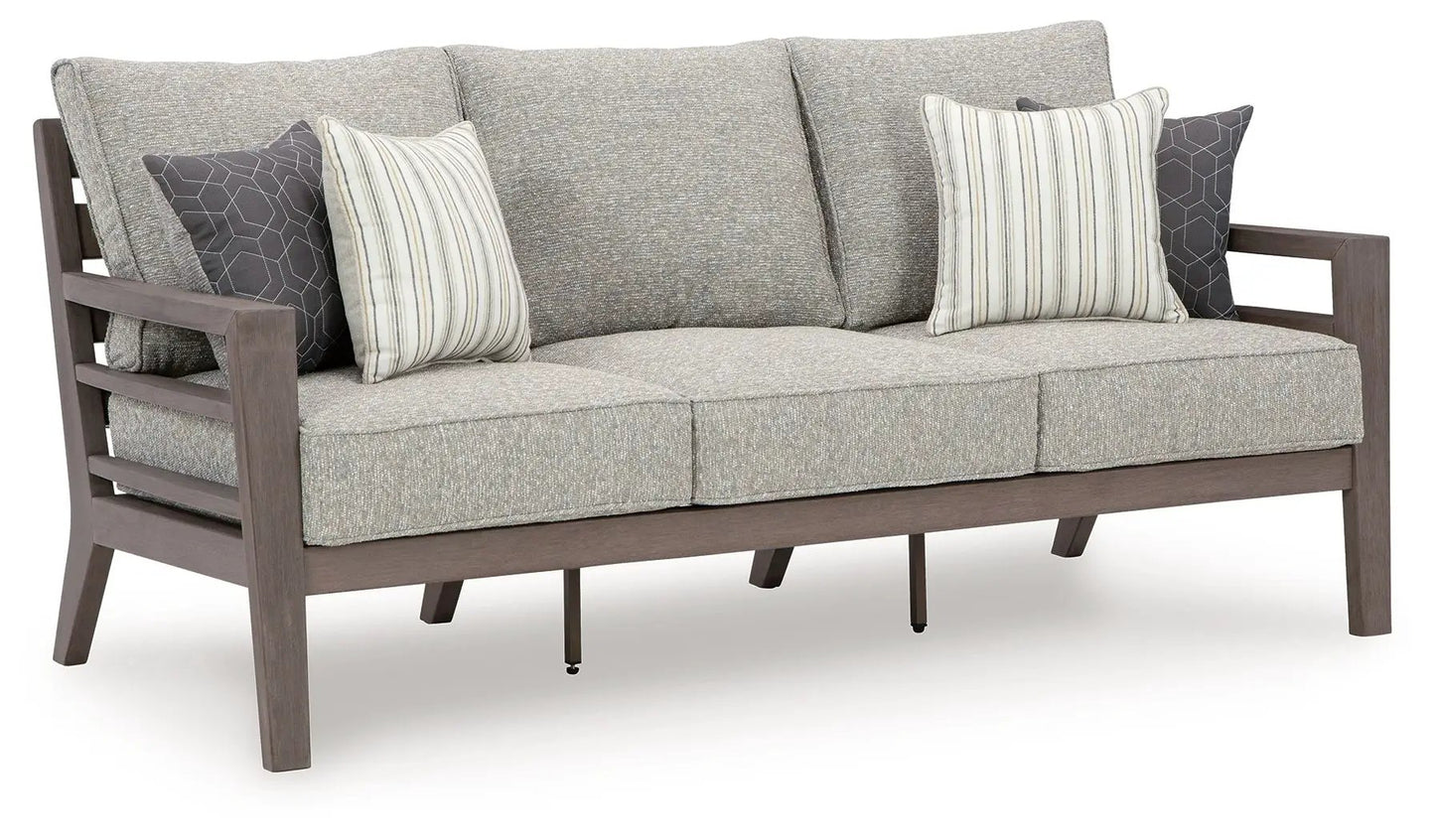 Hillside Barn sofa with gray/brown upholstery, wooden frame, striped and hex pillows on Tampa Home & Garden Store