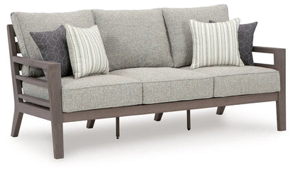 Hillside Barn sofa with gray/brown upholstery, wooden frame, striped and hex pillows on Tampa Home & Garden Store