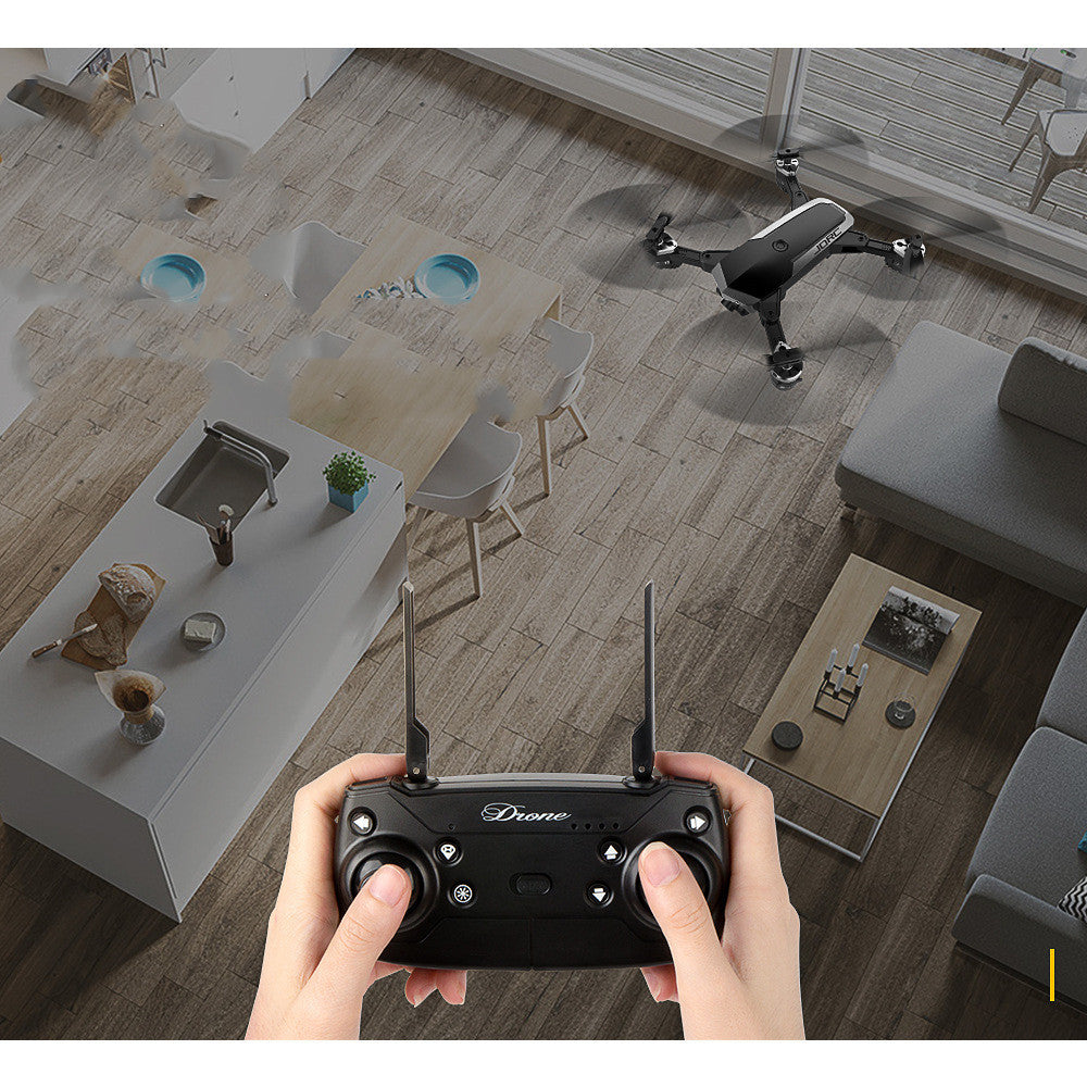 High-Definition Camera Aerial Drone with long flight time, black quadcopter shown with handheld remote on Tampa Home & Garden Store