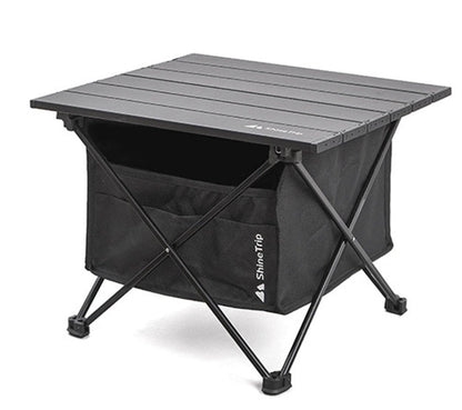 Folding outdoor table with aluminum slat top, cross-leg frame and ShineTrip storage bag on Tampa Home & Garden Store