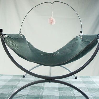 Four Seasons Universal Cat Recliner in green mesh hammock on metal stand with pink pom-pom on Tampa Home & Garden Store