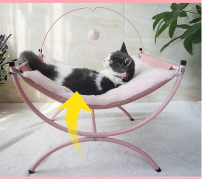 Four Seasons cat recliner hammock with pink plush bed and hanging toy, cat lounging on Tampa Home & Garden Store