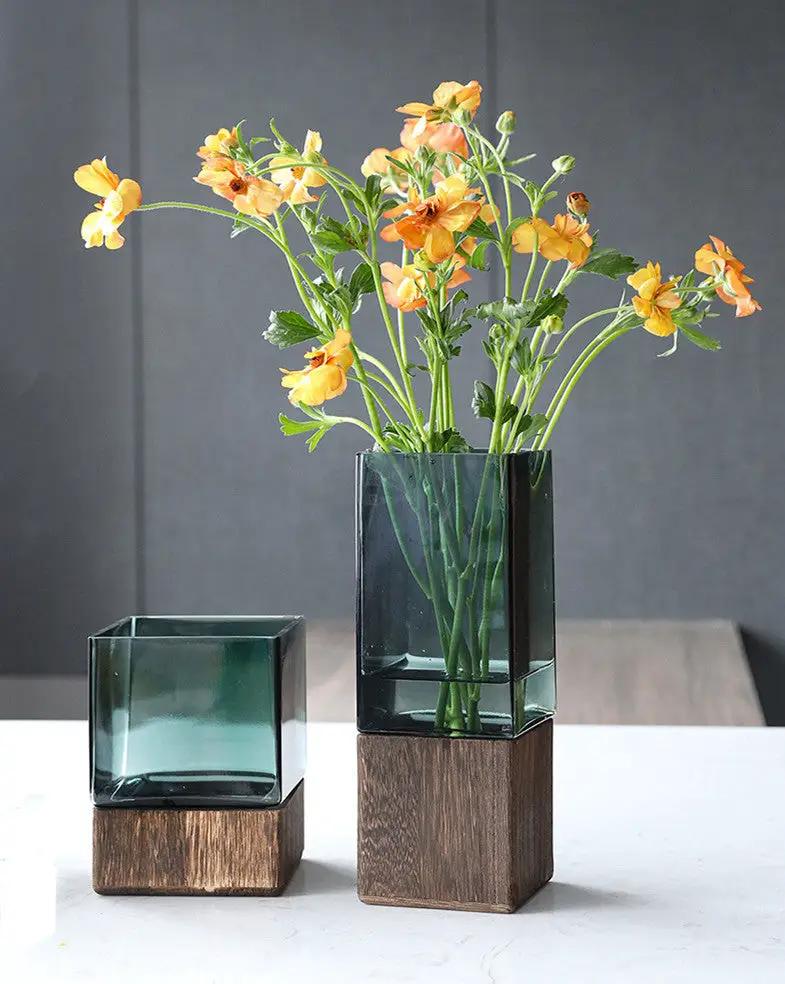 Wood color transparent glass vase set with wooden bases and orange flowers two vases on Tampa Home & Garden Store