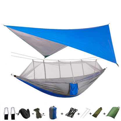 Outdoor parachute-cloth hammock with mosquito net, blue tarp and gray hammock body with straps on Tampa Home & Garden Store