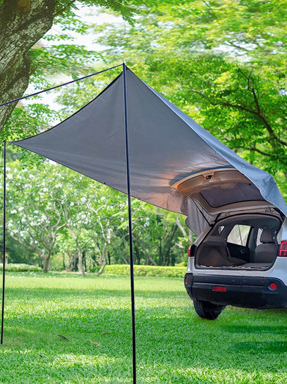 Gray car trunk canopy camping tent extended from SUV with two poles under a shade tarp on Tampa Home & Garden Store