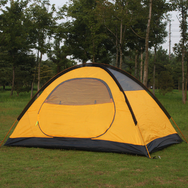 Yellow double-layer aluminum pole tent with gray door panel on a grassy field on Tampa Home & Garden Store
