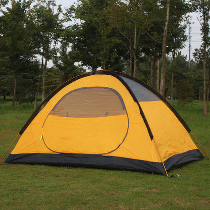 Yellow double-layer aluminum pole tent with gray door panel on a grassy field on Tampa Home & Garden Store