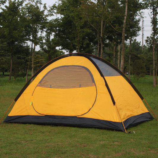 Yellow double-layer aluminum pole tent with gray door panel on a grassy field on Tampa Home & Garden Store