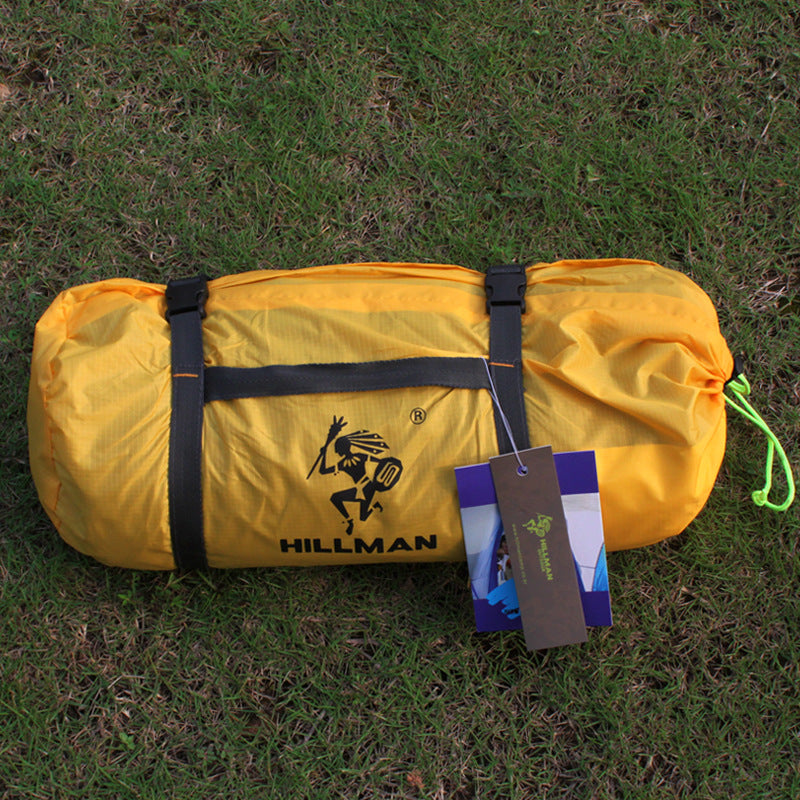 Hillman yellow camping tent bag with black straps and hanging tags on grass on Tampa Home & Garden Store