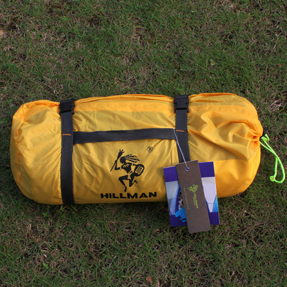 Hillman yellow camping tent bag with black straps and hanging tags on grass on Tampa Home & Garden Store
