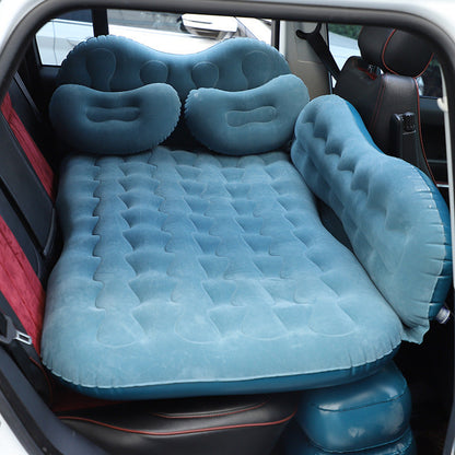 Blue plush inflatable car air mattress with quilted surface placed in back seat with two pillows on Tampa Home & Garden Store