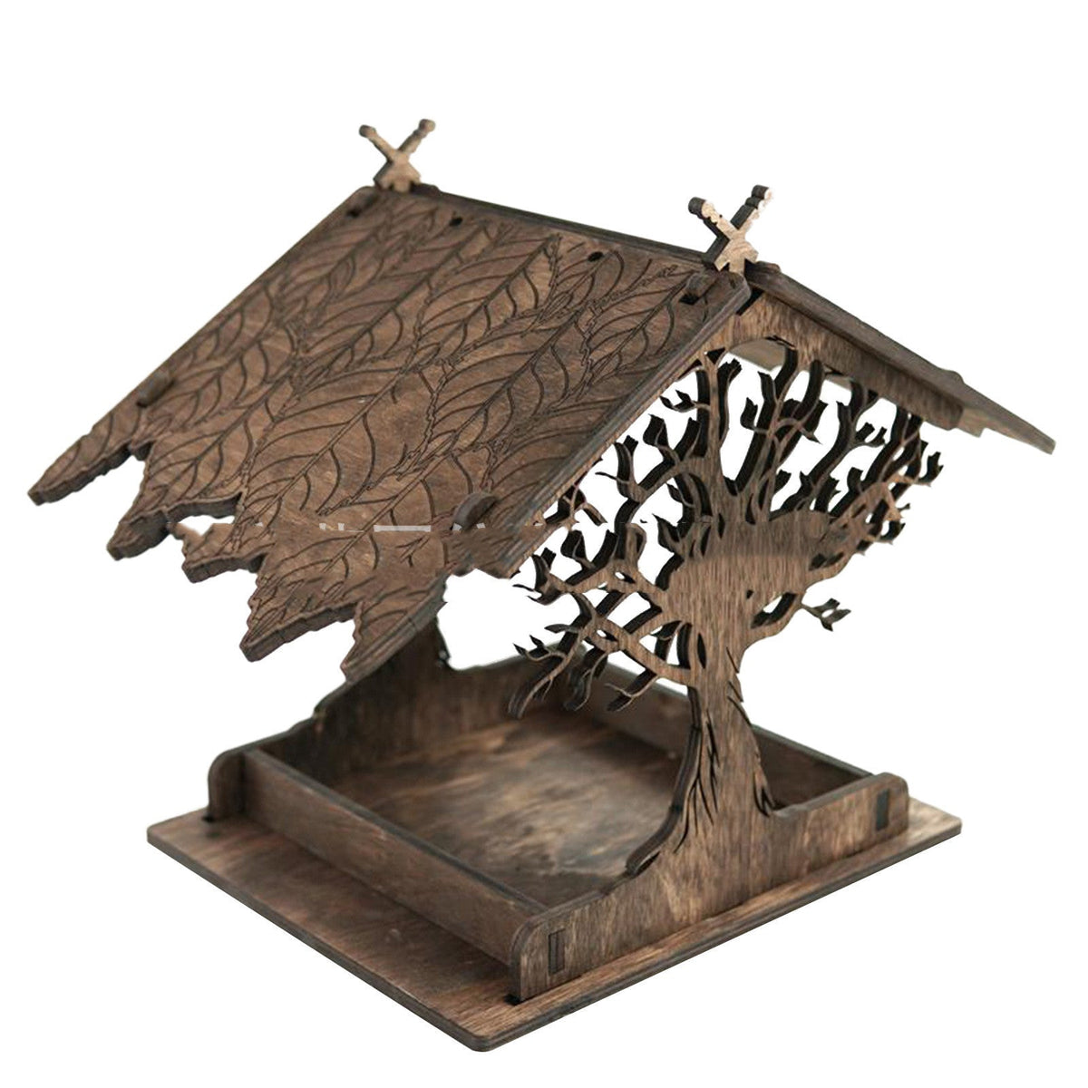 Wooden bird feeder with carved leaf-pattern roof and tree-branch side panels, rustic finish on Tampa Home & Garden Store