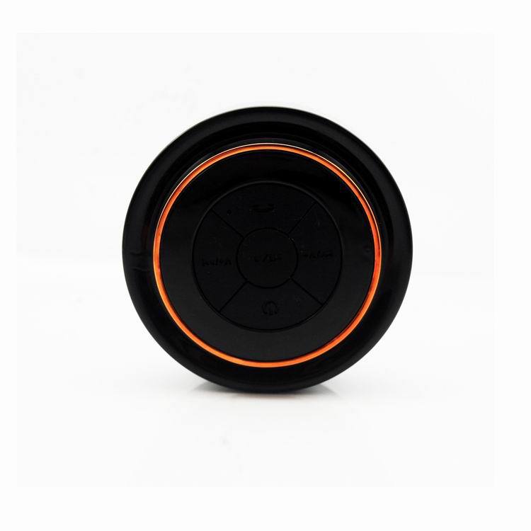 Waterproof Bluetooth speaker, round black unit with orange LED ring, top control pad visible on Tampa Home & Garden Store
