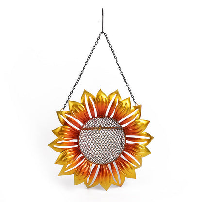 Wrought iron flower bird feeder with orange petals and mesh center hanging by chain on Tampa Home & Garden Store
