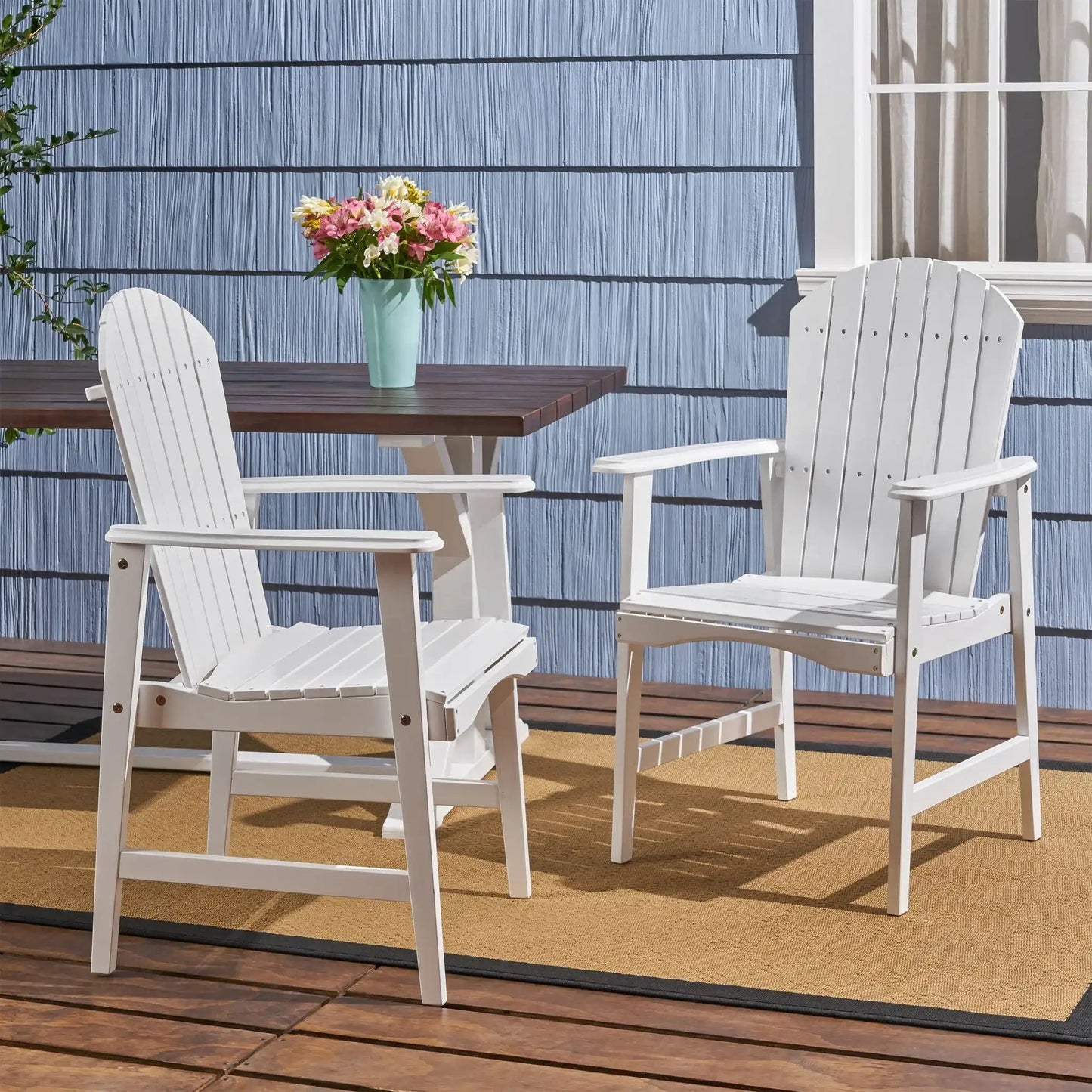White outdoor weather-resistant acacia wood Adirondack dining chairs set of 2 on a wooden deck on Tampa Home & Garden Store