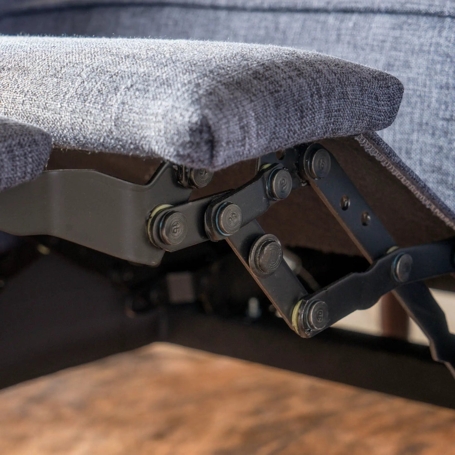 Mid-Century Modern Recliner underside with blue-gray waffle-stitch fabric and exposed rails on Tampa Home & Garden Store