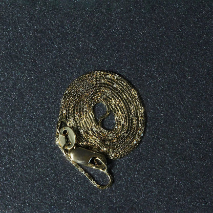 14k yellow gold circular textured pendant on a 0.6mm box chain necklace on Tampa Home & Garden Store