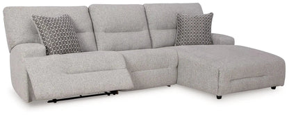 Acklen Place reclining sectional in light gray fabric with two geometric pillows and chaise on Tampa Home & Garden Store