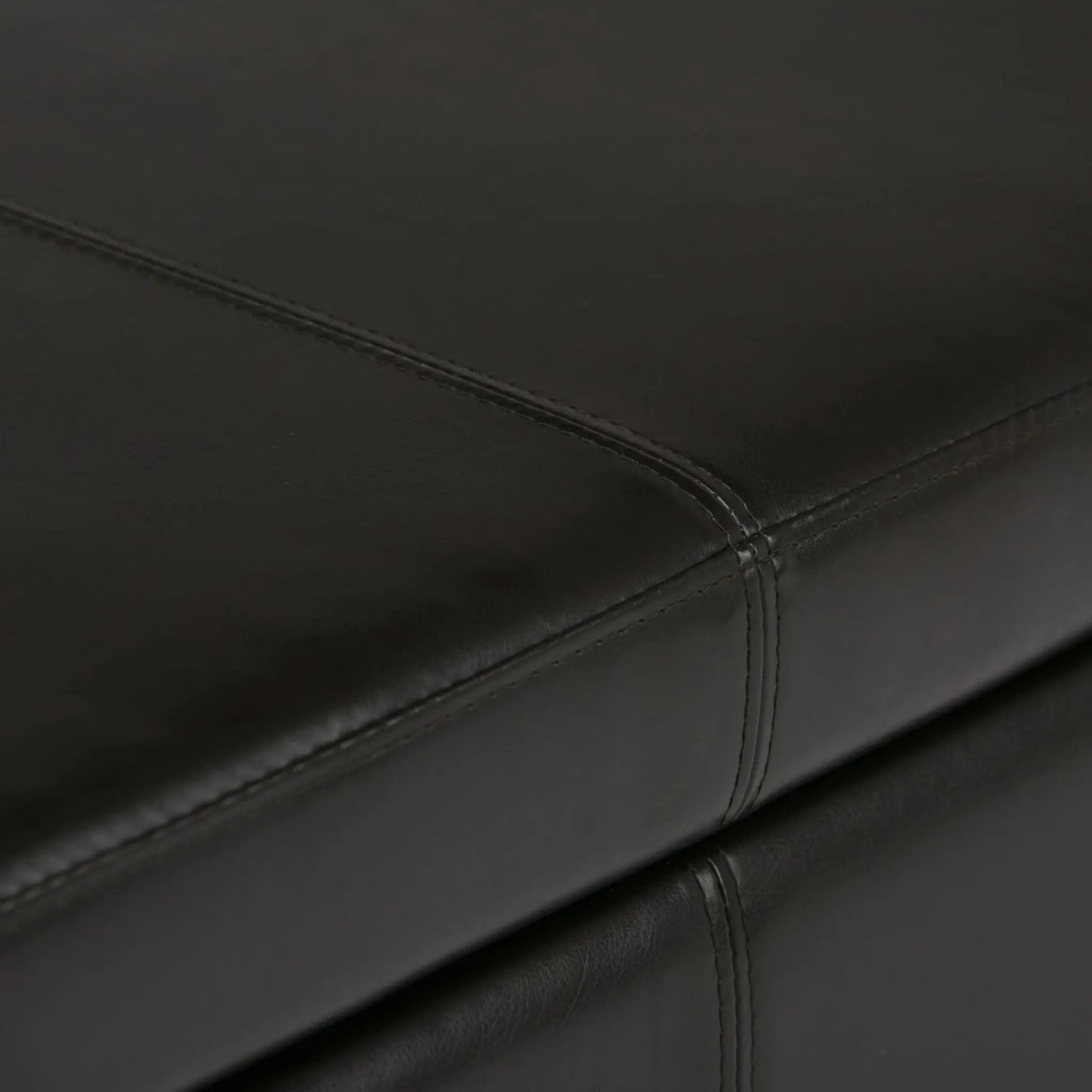 Avalon Multifunctional Storage Ottoman Bench in black leather with visible stitching on Tampa Home & Garden Store