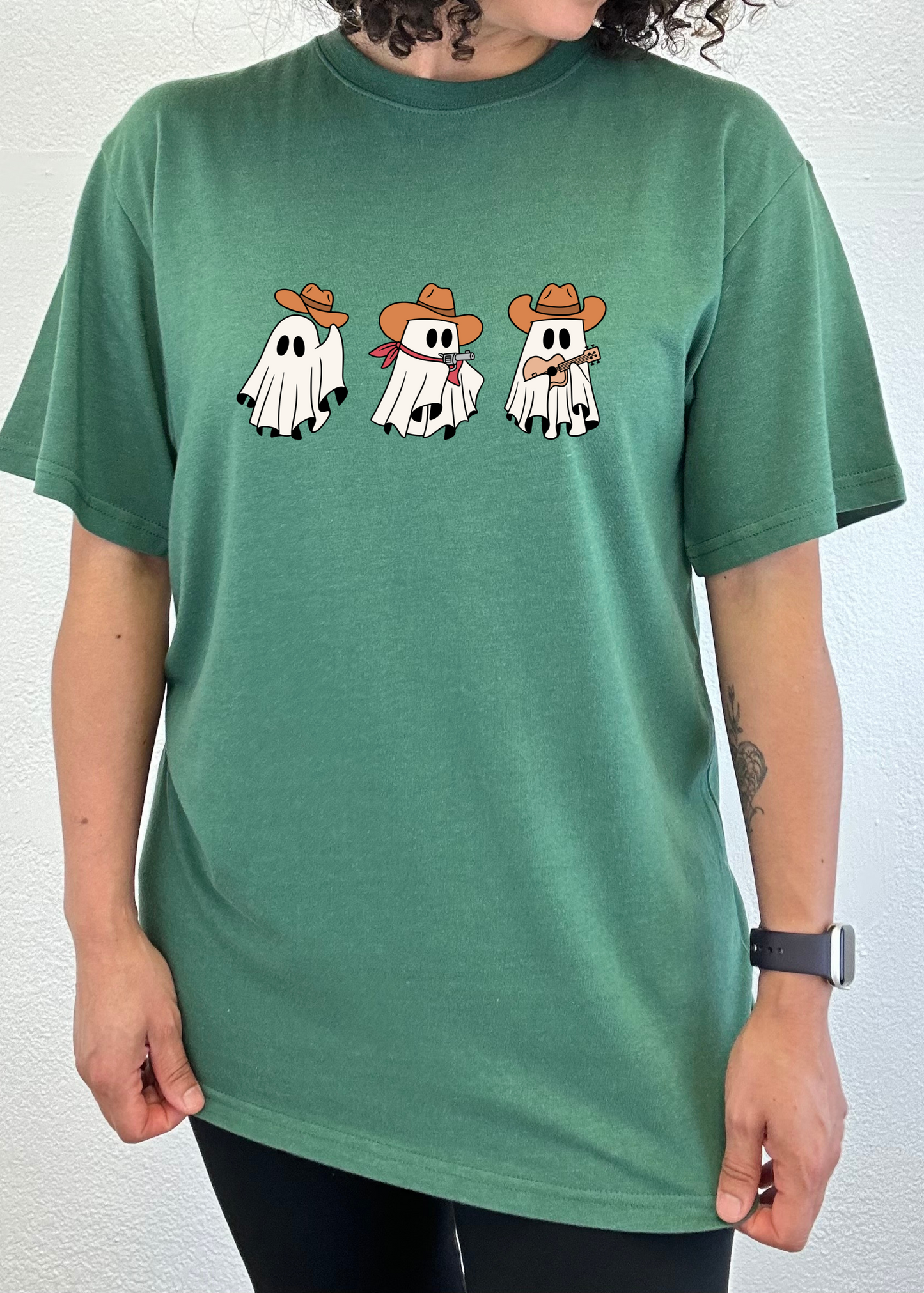 Spun Bamboo green unisex short sleeve graphic tee with three cowboy ghost figures on Tampa Home & Garden Store