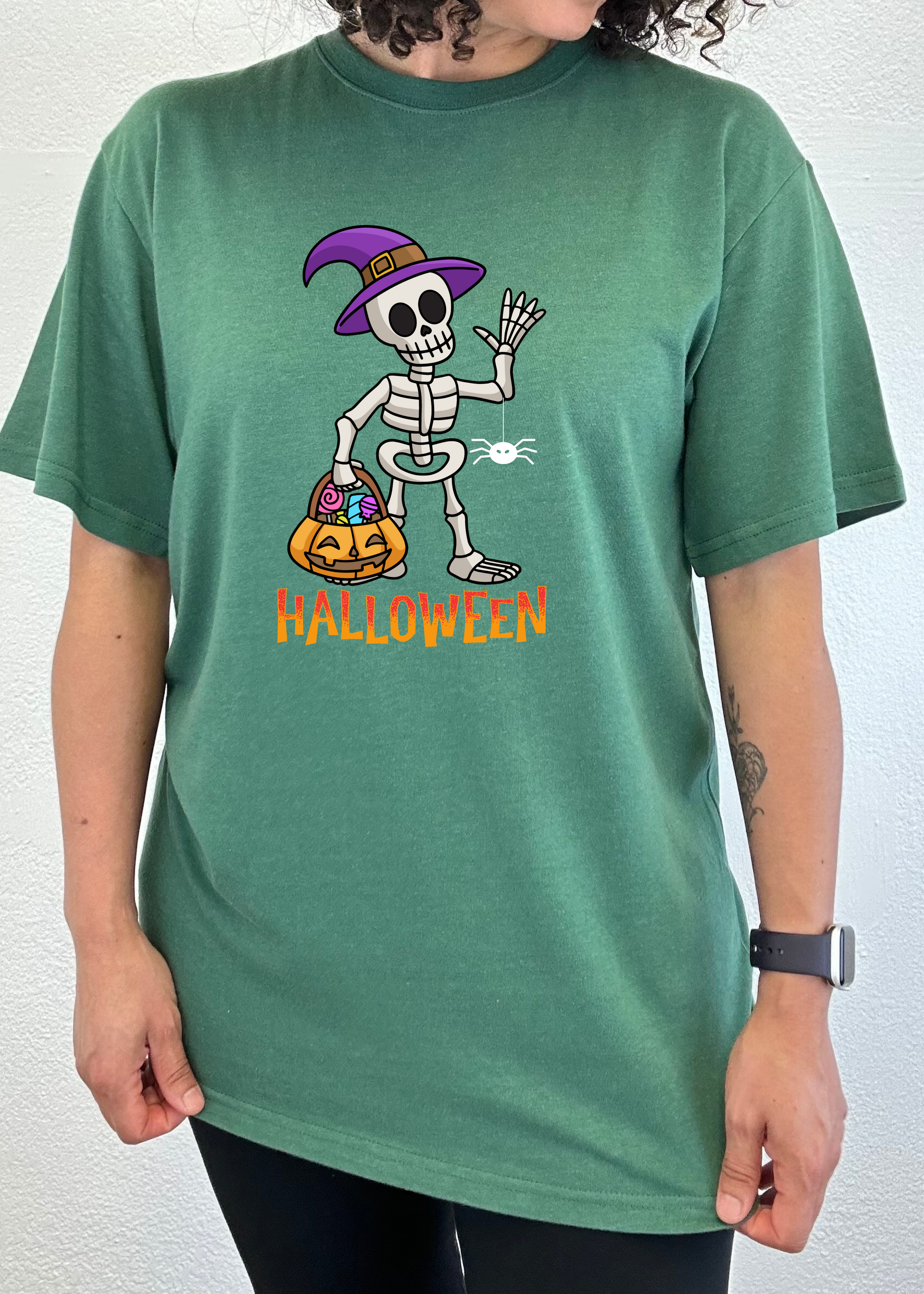 Happy Halloween unisex bamboo viscose/organic cotton T-shirt featuring a skeleton in a purple witch hat on Tampa Home & Garden Store