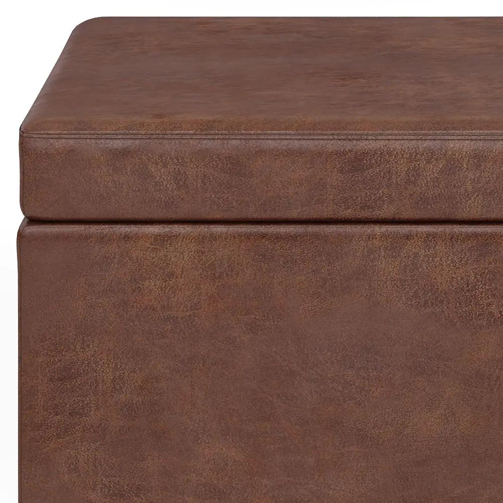 Avalon storage ottoman bench in brown faux leather with stitched edges on Tampa Home & Garden Store