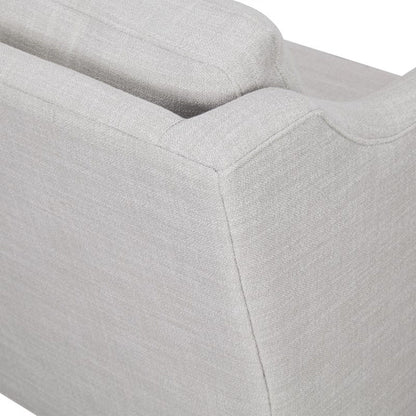 Beige arm chair fabric close-up with tufted cushions and visible seams on Tampa Home & Garden Store